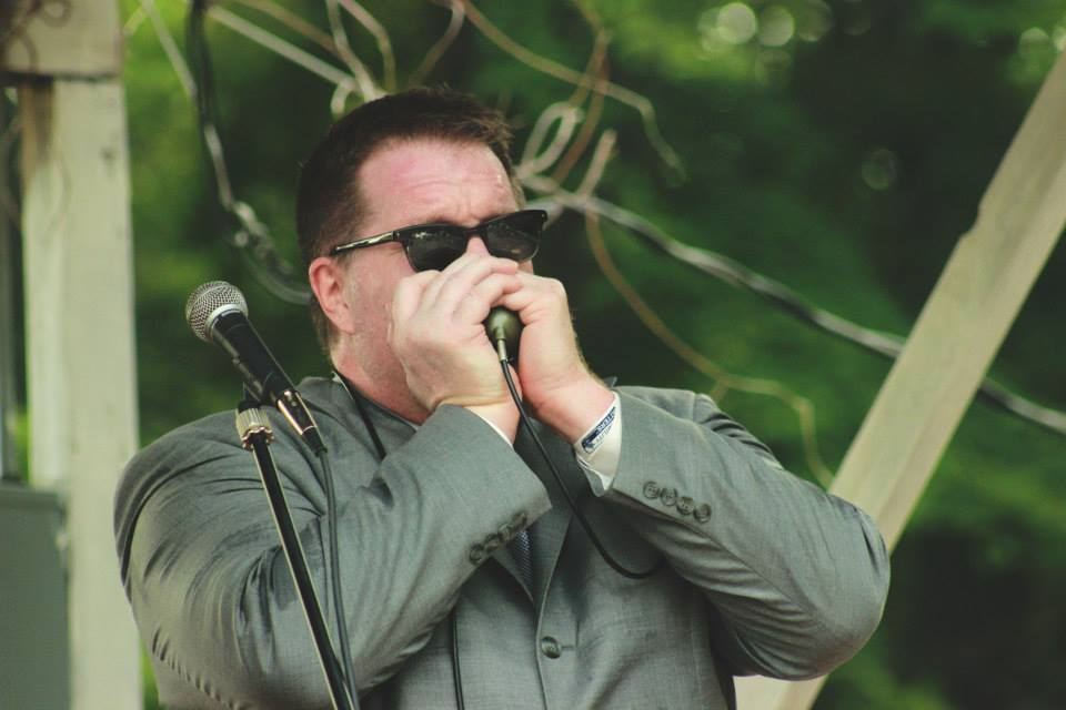 Roger Playing Harmonica